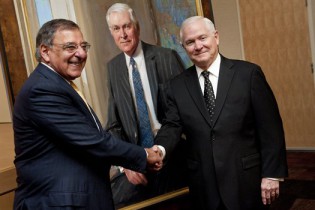 Defense Secretary Leon E. Panetta congratulates Robert M. Gates, who served as the 22nd defense secretary, at the unveiling of Gates' portrait at the Pentagon, Oct. 29, 2012. DOD photo by U.S. Navy Petty Officer 1st Class Chad J. McNeeley