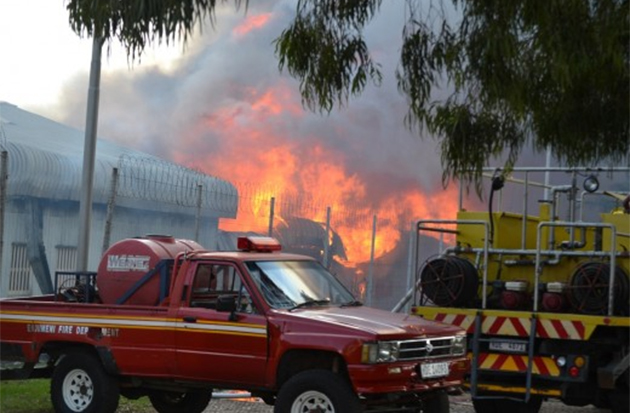 The huge blaze that has broken out at Glencoe Prison is now making its way towards the offices. The fire originated in the dining room before spreading to the kitchen. Most of the prisoners have since been evacuated. All units have been deployed to the prison and emergency services are on route as well. The fire department have made it to the scene, but unconfirmed sources say that they have no water to combat the blaze. – Northern Kwazuli-Natal Courier
