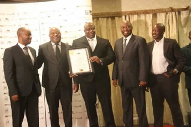 The Herald Editor Caesar Zvayi flanked by (from left) Zimpapers Marketing and Advertising Manager Munyaradzi Hatendi, Marketers Association of Zimbabwe president Tapuwa Mandimutsira, Herbert Simemeza; the Zimpapers Group Human Resources Manager and Zimpapers (Harare Branch) General Manager Samuel Bepe after receiving the Superbrand of the Year 2014 Award in the print media category in Harare last night