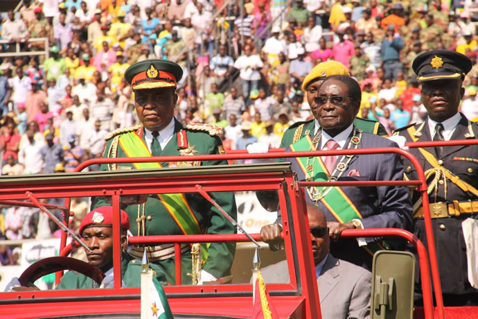 The Commander in Chief of the Zimbabwe Defences President Mugabe inspects the Guard of Honour accompanied by ZDF Commander General Constantine Chiwenga today