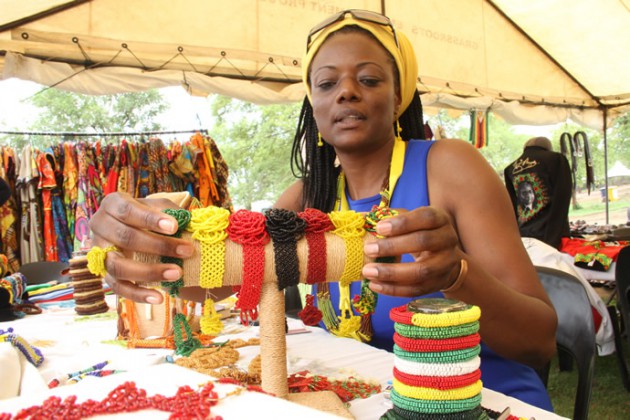 One of the exhibitors arranges her ware at conference.