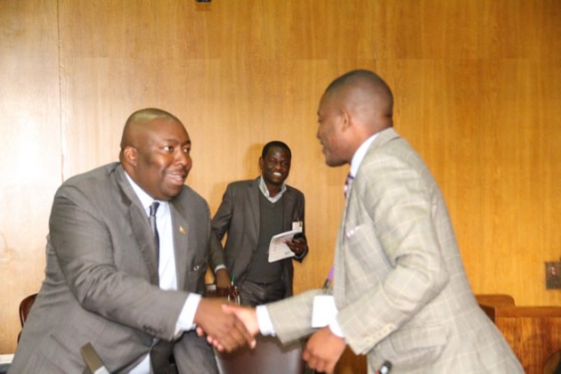 Minister Kasukuwere (L)shakes hands with Cde Wadyajena after the meeting.