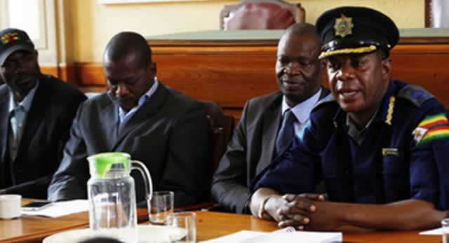 ZRP Officer Commanding Harare Province Senior Assistant Commissioner Clement Munoriarwa addresses representatives of vendors, flea marketers and kombi operators at Town House yesterday while to his right are town clerk Dr Tendai Mahachi, council spokesperson Mr Leslie Gwindi and vendors association chairperson Mr Alexio Mudzengerere