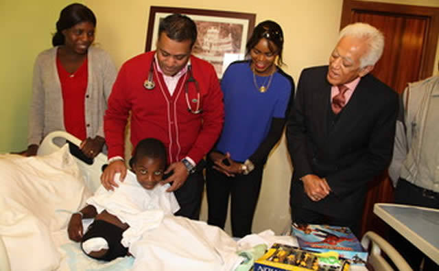 Dr Vivek Solanki assists Shingirai Bushu whose leg was amputated at Trauma Centre in Harare yesterday. Looking on are his mother Mavis Bushu (left), Patron of Musha Mukadzi Mrs Mary Chiwenga and Mr Kamal Khalfan, consul of the Sultanate of Oman in Zimbabwe. — Picture by Tawanda Mudimu