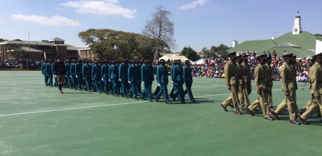 Police officers march in quick march