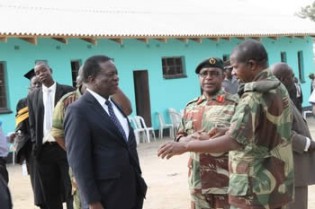Outgoing Defence Minister Emmerson Mnangagwa chats with Brigadier Francis Mutisi (centre) and Zimbabwe National Army commander Lt Gen Phillip Valerio Sibanda after officially opening Nyakasikana Primary School which was built by the army in Beatrice
