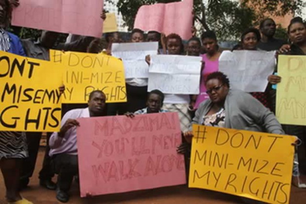 Human rights activists demonstrate at the Harare Magistrates Courts in Harare yesterday against touts who stripped a woman recently at the Fourth Street Bus Terminus. - (Picture by Innocent Makawa)