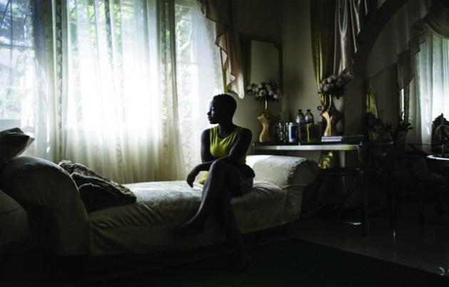Rosita Mabuiango, who 17 years ago was born in a tree during floods in Mozambique in 2000, sits in her lounge in Maputo
