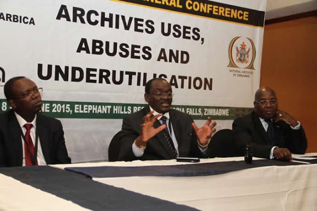 Home Affairs minister Kembo Mohadi is flanked by his permament secretary Melusi Matshiya and ESARBRICA vice president and National Archives of Zimbabwe director Ivan Murambiwa(left) as he addresses the media on the ESARBICA 23rd General Conference in Victoria Falls today.