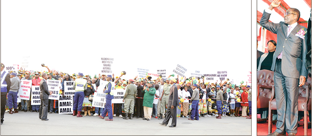 zanu-pf supporters listen to President Mugabe`s address on his arrival from China at the Harare International Airport yesterday. —(Picture by Presidential Photographer Joseph Nyadzayo)
