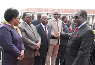 President Mugabe is seen off at Harare International Airport by (from left) Vice President Joice Mujuru, Senior Minister of State Simon Khaya Moyo, Presidential Affairs Minister Didymus Mutasa and Information, Media and Broadcasting Services Minister Professor Jonathan Moyo before his departure for South Africa yesterday. — (Picture by Tawanda Mudimu)