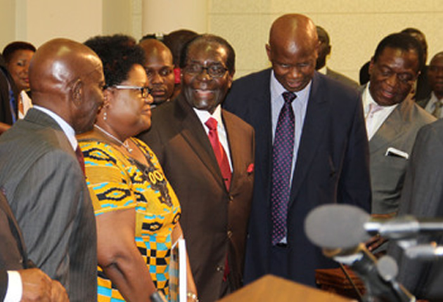 President Mugabe shares a lighter moment with Vice President Joice Mujuru, Presidential Affairs Minister Didymus Mutasa (left), Finance Minister Patrick Chinamasa and Justice, Legal and Parliamentary Affairs Minister Emmerson Mnangagwa before the presentation of the National Budget in Parliament yesterday. — (Picture by Tawanda Mudimu)