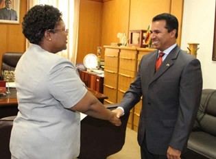 Acting President Joice Mujuru welcomes outgoing Kuwaiti Ambassador to Zimbabwe Mr Abdullar Al-Sharham at her Munhumutapa Offices in Harare yesterday