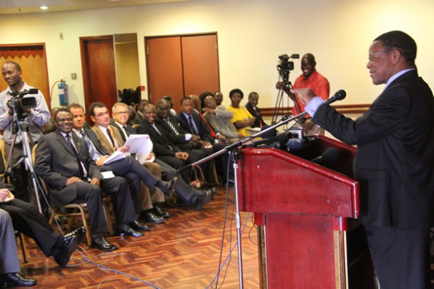 Head of SADC Observer Mission Bernard Membe addresses members of the media, diplomats and other delegation as he present 2013 election report.