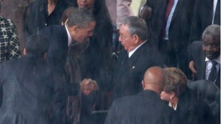 Obama shook hands with Castro before delivering his eulogy. - TOPSHOTS/AFP.