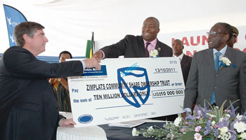 Mining giant gives shares to communities