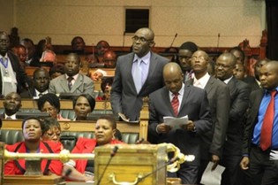Legislators follow proceedings during the first sitting of the First Session of the Eighth Parliament of Zimbabwe while standing in the aisles owing to an acute shortage of sitting space in the National Assembly yesterday.
