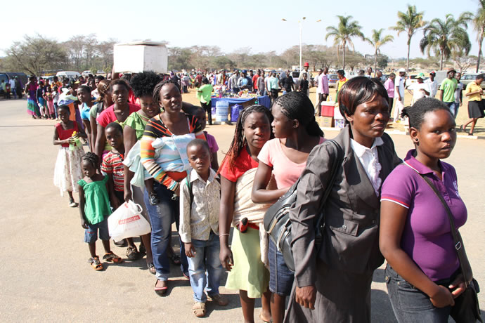 People queue to enter the National Sports Stadium this morning