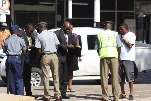 Police conduct spot searches of people attending the opening of the parliament