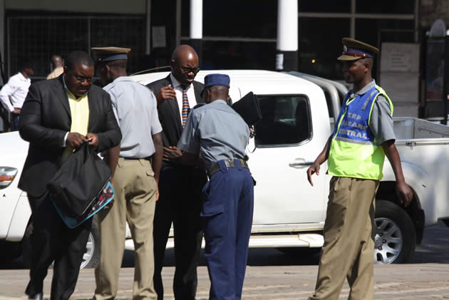 Police conduct spot searches of people attending the opening of the parliament