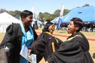 BOUNDLESS JOY . . . Maud Jaya, Morrine Chimukombe and  Patricia Makorokoto celebrate after graduating from Harare Polytechnic yesterday