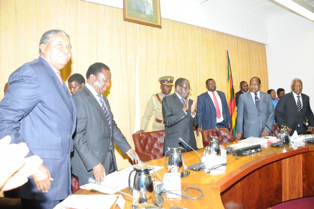 This collage (top to bottom) shows President Mugabe being welcomed on arrival at his Munhumutapa Offices yesterday by his spokesperson Mr George Charamba, walking unassisted in the corridor and greeting his deputies Cdes Phelekezela Mphoko and Emmerson Mnangagwa and other Cabinet ministers before he proceeded to chair a seven-hour Cabinet session 
