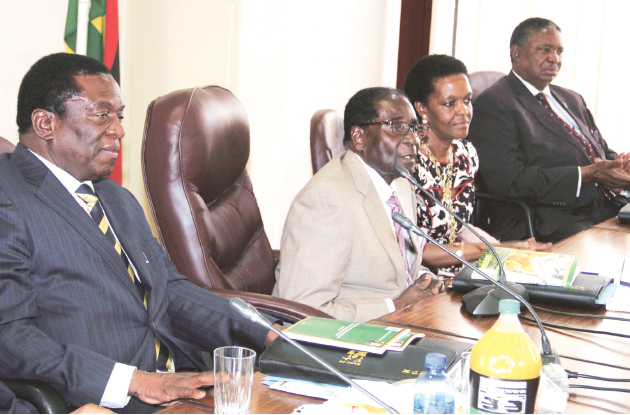 President Mugabe addresses the Politburo at zanu-pf Headquarters in Harare yesterday while flanked by First Lady Amai Grace Mugabe and Vice Presidents Cdes Emmerson Mnangagwa (left) and Phelekezela Mphoko