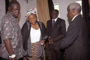 President Mugabe and Defence Minister Sydney Sekeramayi console Air Force of Zimbabwe Commander Air Marshal Perrance Shiri and mother to the late Titus Takudzwa Chikerema, Ms Angeline Chiponda in Borrowdale, Harare, yesterday