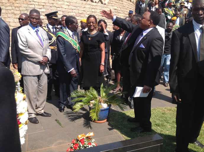 President Mugabe with the First Lady prepares to lay a wreath at the late VP Joshua Nkomo's grave