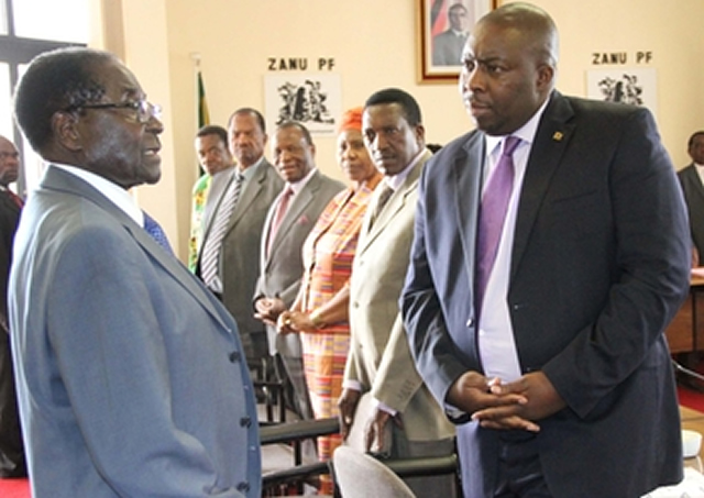 President Mugabe chats with Environment, Water and Climate Minister Saviour Kasukuwere at a Zanu-PF Politburo meeting at the revolutionary party’s headquarters in Harare yesterday