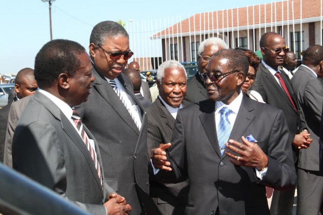 President Mugabe talking to Vice Presidents Emmerson Mnangagwa, Phelekezela Mphoko while Ministers Sydney Sekeramayi, Ignatius Chombo, Mirriam Chikukwa and Professor Jonathan Moyo look on before his departure for Algeria this morning. (Picture by John Manzongo).