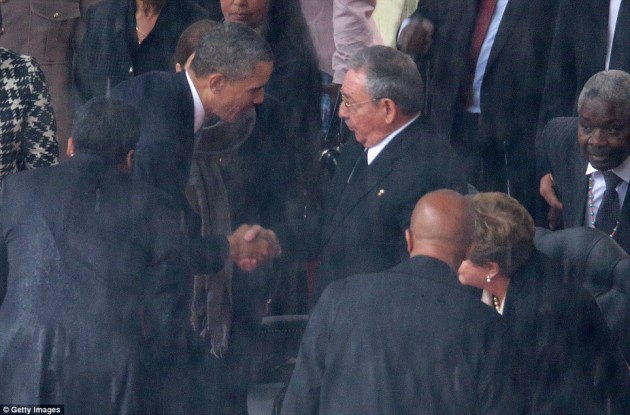 Rare display of unity US president Obama shakes hands Cuban leader Raul Castro inspite of the animosity between them-Daily Mail