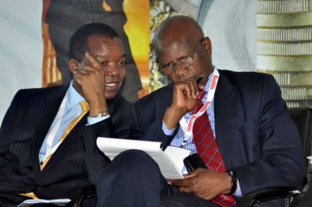 RBZ Governor Dr John Mangudya talks to Finance Minister Patrick Chinamasa during the breakfast meeting recently