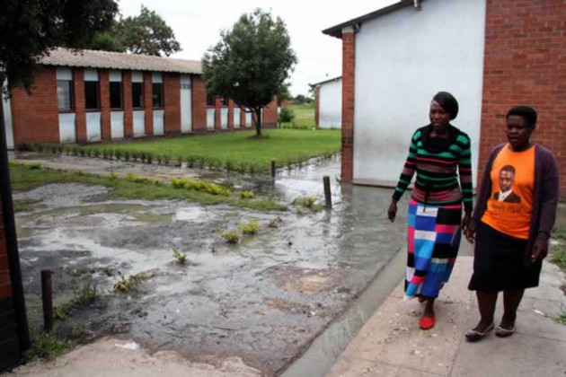 Glen View 4 Primary School SDA vice chairperson Ms Patience Gonese (left) and Ottilia Chivese, a committee member, walk past raw sewage at the school. — (Picture by William Mafunga)