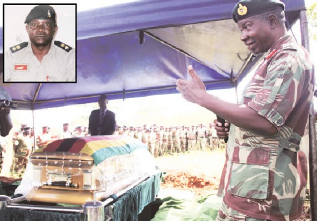 Zimbabwe National Army Commander Lieutenant-General Philip Valerio Sibanda speaks at the burial of the late liberation war hero, Lieutenant-Colonel Ronald Patrick Munyanduki (inset) at Glen Forest Cemetery in Harare yesterday. — (Picture by Memory Mangombe)