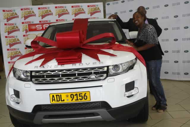 Cynthia Musingwanani admires the Range Rover Evoque she won in the Spar Hoza Summer promotion