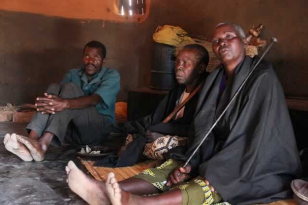Spirit mediums (from right) Mbuya Mugarandega and Mbuya Nyakutumbwa explain the history of Chief Chingaira Makoni while Mr Joseph Nyakutumbwa (left) listens