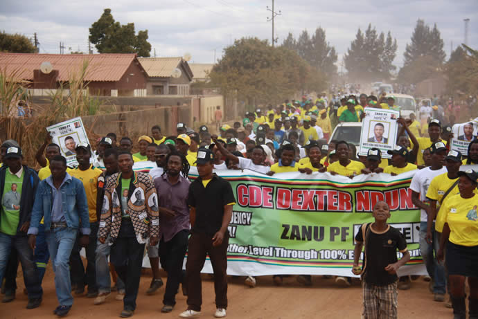 Zanu-PF supporters, mostl who had defected from MDC-T march with Chegutu West candidate Cde Dexter Nduna in support of President Mugabe