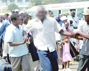 Bus fatally crushes tout
