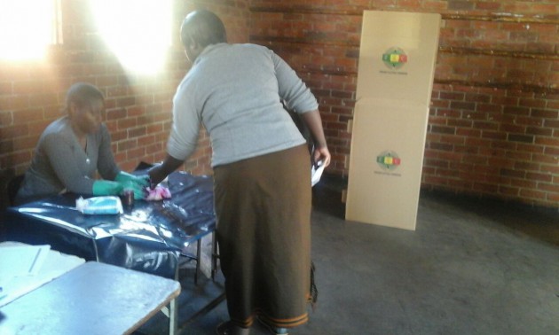 A voter prepares to cast her ballot.
