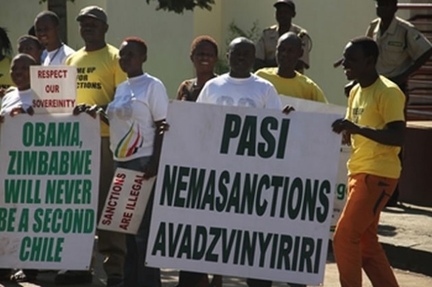 Children of Zimbabwe Liberation War Veterans Association members demonstrate against the sanctions imposed on Zimbabwe by the West at the United States Embassy in Harare yesterday