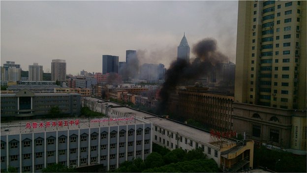 Smoke could be seen billowing over the street in Urumqi where the blast took place