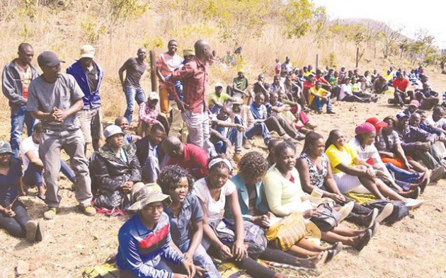 Some of the zanu-pf youths who helped dig graves at Manicaland Provincial Heroes Acre await transport to ferry them to Chimoio and Beira in Mozambique where they are expected to lay wreaths at the shrines of fallen heroes