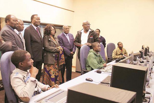 Ministers (from left) Simbarashe Mumbengegwi (Foreign Affairs), Samuel Undenge (Energy and Power Development), Josaya Hungwe (State for Liaising on Psychomotor Activities in Education and Vocational Training), Miriam Chikukwa (State for Harare Provincial Affairs) and Christopher Mushohwe (Information, Media and Broadcasting Services) listen as Engineer Matthias Chakanyuka explains operations in a ZBC control room in Harare yesterday. — (Picture by Tawanda Mudimu)