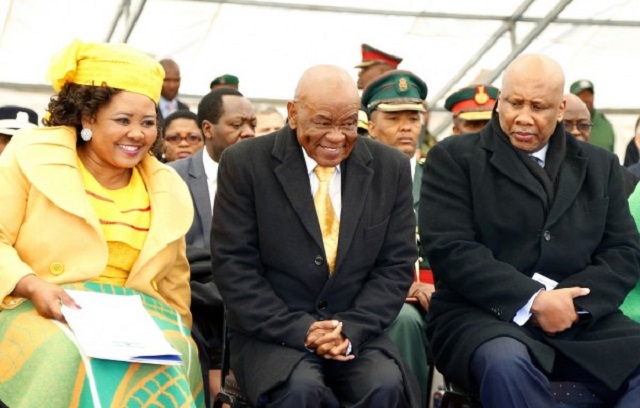 Newly appointed LesothoPrime Minister Thomas Thabane (C), his wife 'Ma Isaiah Ramoholi Thabane (L) and Lesotho King Letsie III at Thabane's inauguration in Maseru on June 16, 2017.