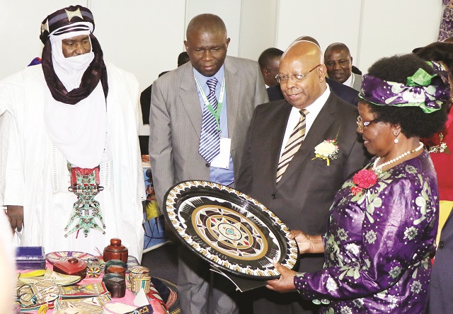 Minister of Small to Medium Enterprises and Co-operative Development and now CODEPA chair admires some of the Niger craftwork while Speaker of Parliament Advocate Mudenda and officials from Niger look on during a tour of stands at the Coordination Committee for Development and Promotion of African Handicrafts (CODEPA) conference in Bulawayo on Friday. — Picture by Eliah Saushoma