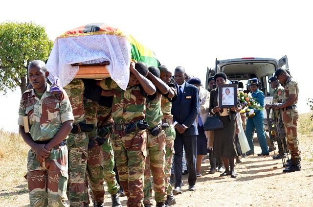 Pall bearers carry the body of the cde Kenny Ndlovu at the Bulawayo Provincial heroes acre yesterday.(Picture by Obey Sibanda)