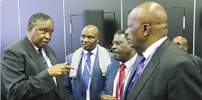 Vice President Phelekezela Mphoko stresses a point to Ministers Walter Chidhakwa, Mike Bimha and Patrick Chinamasa after delivering his address at the Russia-Africa Business round table at St Petersburg in Russia yesterday.— (Picture by Eliah Saushoma).