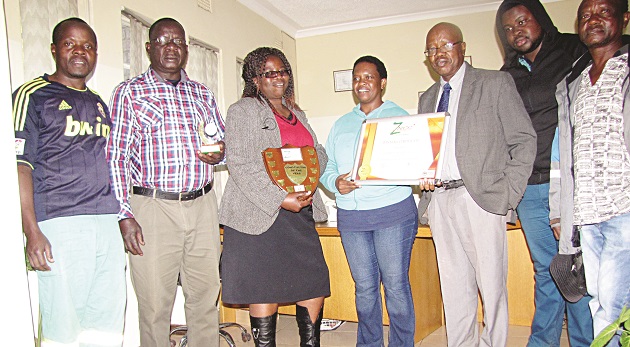 Office staff proudly display the award