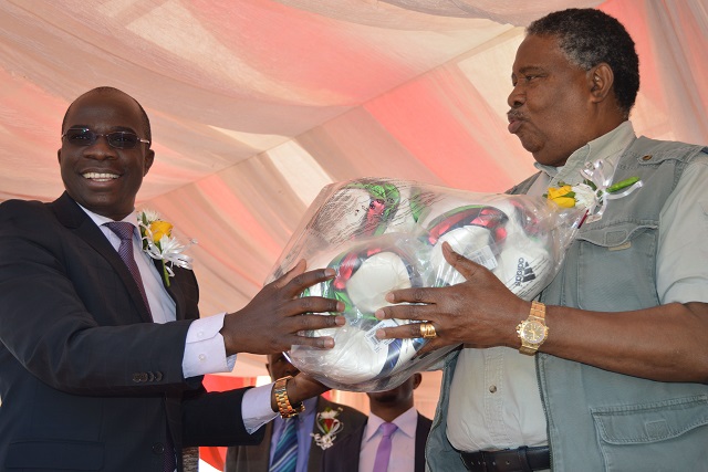 Vice President Phelekezela Mphoko (right) receives footballs from the Minister of Sport and Recreation Cde Makhosini Hlongwane as a token of appreciation after the VP officially launched the Community Sports and Recreation Club System at Nyamandlovu primary school in Nyamandlovu yesterday......